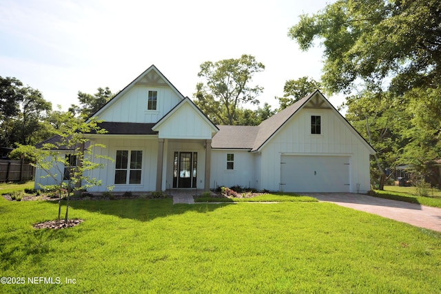 95121 N Ellis Landing Rd, Fernandina Beach, FL 32034 - modern inspired farmhouse with board and batten siding, driveway, a front lawn, and a shingled roof