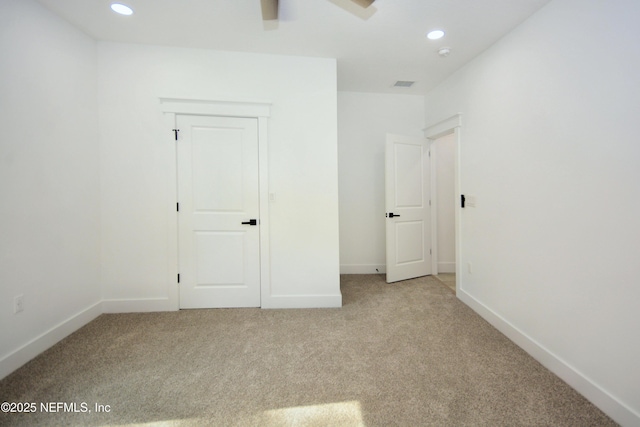 95121 N Ellis Landing Rd, Fernandina Beach, FL 32034 - unfurnished bedroom with carpet floors, recessed lighting, baseboards, and a ceiling fan