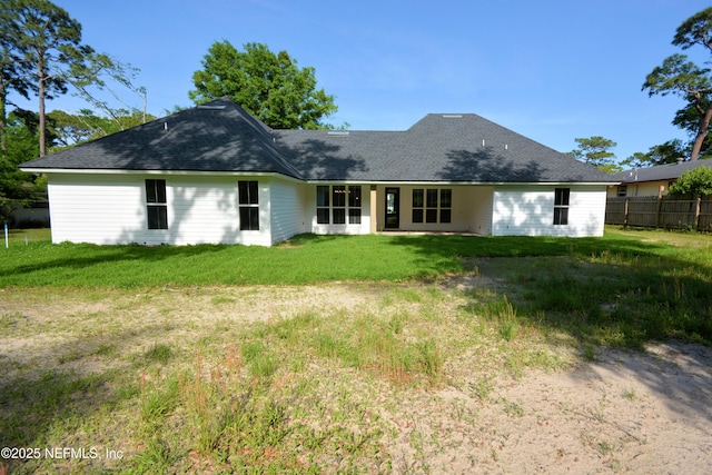 95121 N Ellis Landing Rd, Fernandina Beach, FL 32034 - rear view of house featuring roof with shingles