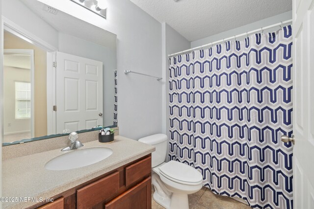 467 S Aberdeenshire Dr, Saint Johns, FL 32259 - bathroom featuring toilet, vanity, tile patterned floors, a shower with curtain, and a textured ceiling