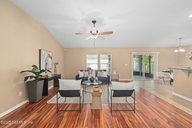 467 S Aberdeenshire Dr, Saint Johns, FL 32259 - living area featuring ceiling fan, baseboards, a chandelier, lofted ceiling, and wood finished floors
