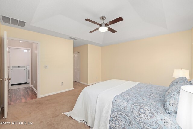 467 S Aberdeenshire Dr, Saint Johns, FL 32259 - bedroom with carpet flooring, washing machine and clothes dryer, baseboards, a ceiling fan, and a raised ceiling