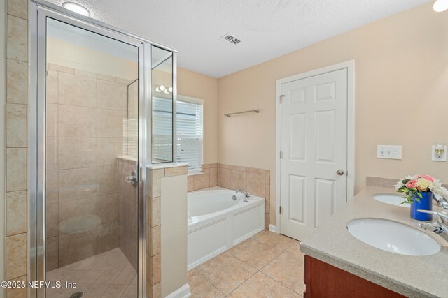 467 S Aberdeenshire Dr, Saint Johns, FL 32259 - bathroom featuring a garden tub, tile patterned flooring, a shower stall, and double vanity