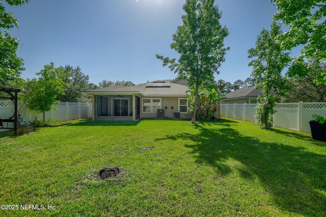 467 S Aberdeenshire Dr, Saint Johns, FL 32259 - rear view of house featuring a sunroom, solar panels, central AC unit, and stucco siding