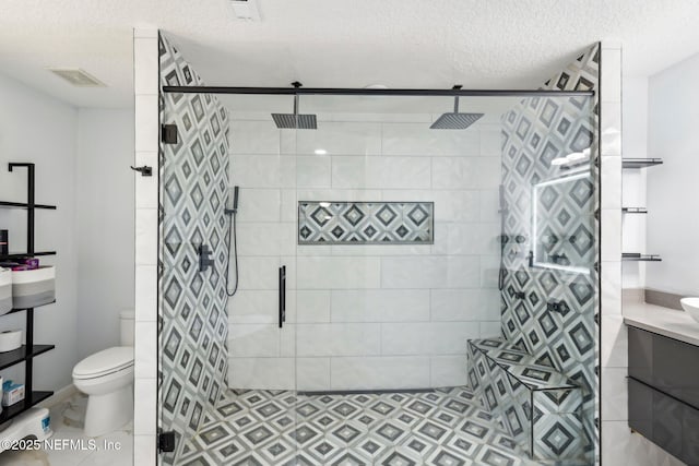 3100 Hickory Glen Dr, Orange Park, FL 32065 - full bathroom featuring toilet, a textured ceiling, a stall shower, and vanity