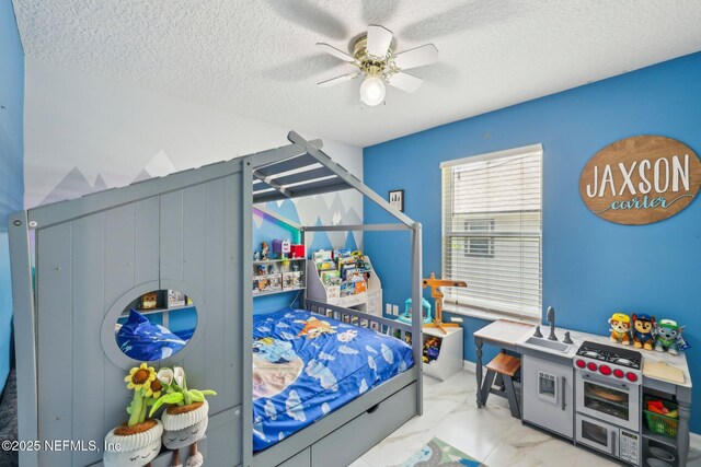 3100 Hickory Glen Dr, Orange Park, FL 32065 - bedroom featuring a textured ceiling, ceiling fan, and marble look tile flooring