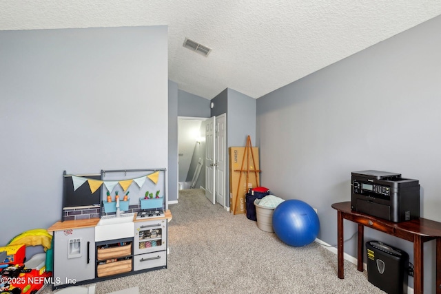 3100 Hickory Glen Dr, Orange Park, FL 32065 - playroom with vaulted ceiling, carpet flooring, a textured ceiling, and baseboards