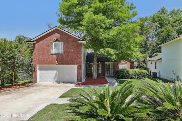 3100 Hickory Glen Dr, Orange Park, FL 32065 - view of front of house featuring brick siding, an attached garage, central AC unit, and driveway