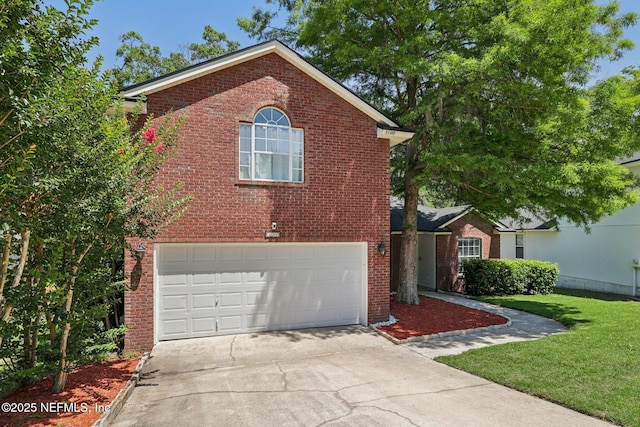 3100 Hickory Glen Dr, Orange Park, FL 32065 - view of front of property featuring brick siding, a garage, driveway, and a front lawn