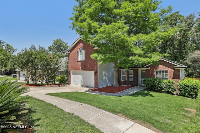 3100 Hickory Glen Dr, Orange Park, FL 32065 - view of front of house featuring brick siding, concrete driveway, an attached garage, and a front lawn