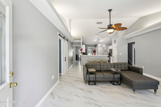 3100 Hickory Glen Dr, Orange Park, FL 32065 - living area with a barn door, light marble finish floors, ceiling fan, lofted ceiling, and baseboards