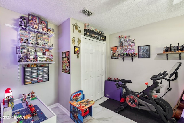 3100 Hickory Glen Dr, Orange Park, FL 32065 - exercise area featuring marble finish flooring and a textured ceiling