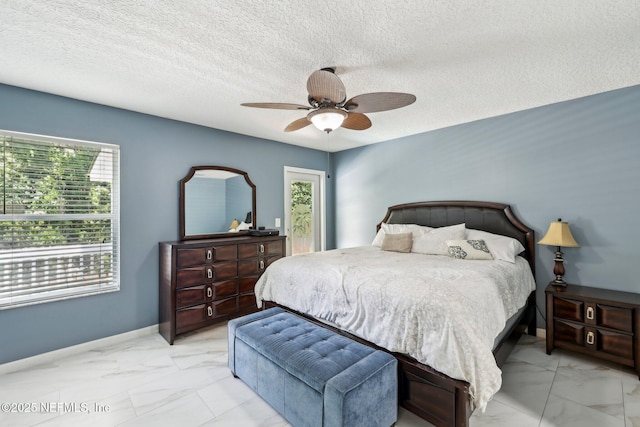 3100 Hickory Glen Dr, Orange Park, FL 32065 - bedroom with light marble finish flooring, ceiling fan, a textured ceiling, and baseboards