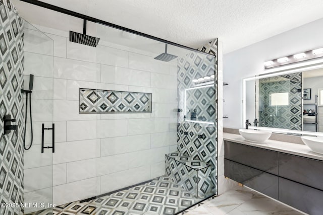 3100 Hickory Glen Dr, Orange Park, FL 32065 - full bathroom with tiled shower, double vanity, and a textured ceiling