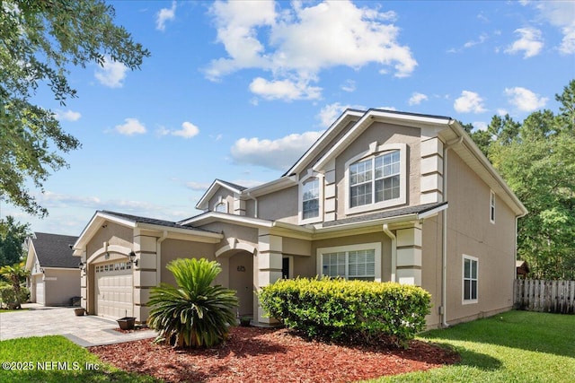8719 Derry Dr, Jacksonville, FL 32244 - view of front of property with an attached garage, stucco siding, and driveway