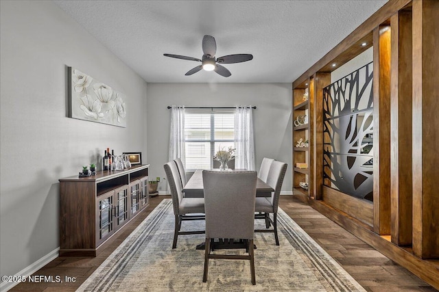 8719 Derry Dr, Jacksonville, FL 32244 - dining room with baseboards, a textured ceiling, ceiling fan, and wood finished floors
