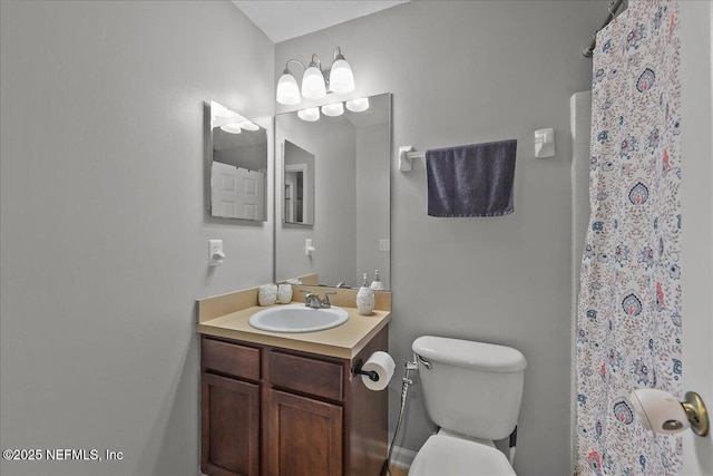 8719 Derry Dr, Jacksonville, FL 32244 - bathroom featuring toilet, vanity, and a shower with curtain