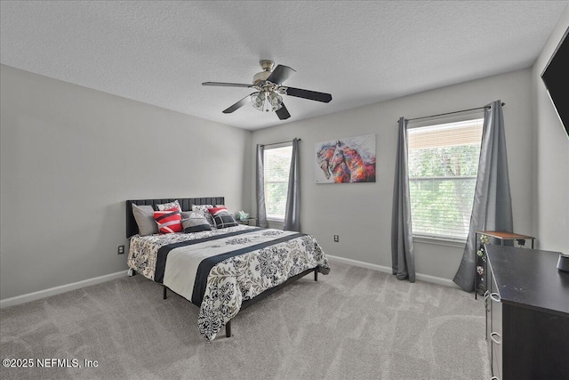 8719 Derry Dr, Jacksonville, FL 32244 - bedroom featuring baseboards, light colored carpet, a textured ceiling, and ceiling fan