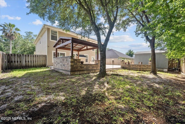 8719 Derry Dr, Jacksonville, FL 32244 - rear view of house featuring stucco siding and a fenced backyard