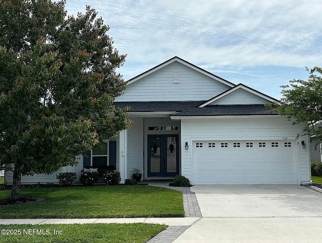 2035 Arden Forest Pl, Fleming Island, FL 32003 - view of front of house featuring a garage, a front yard, french doors, driveway, and roof with shingles