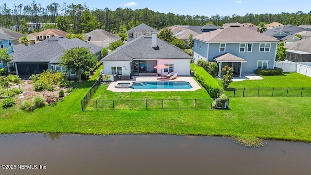 2035 Arden Forest Pl, Fleming Island, FL 32003 - rear view of house with a residential view, a patio area, a pool with connected hot tub, and a water view