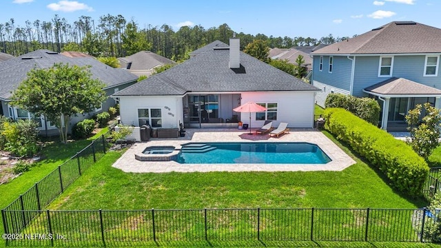 2035 Arden Forest Pl, Fleming Island, FL 32003 - back of property with a patio, a chimney, a pool with connected hot tub, and roof with shingles