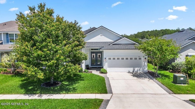 2035 Arden Forest Pl, Fleming Island, FL 32003 - view of front of home featuring roof with shingles, an attached garage, a front lawn, and concrete driveway