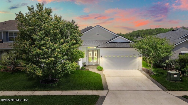2035 Arden Forest Pl, Fleming Island, FL 32003 - view of front facade with a garage, roof with shingles, concrete driveway, and a front yard