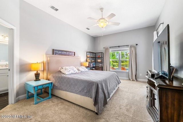 2035 Arden Forest Pl, Fleming Island, FL 32003 - bedroom featuring carpet flooring, baseboards, connected bathroom, and a ceiling fan
