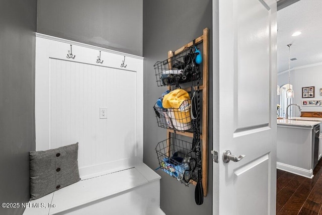 2035 Arden Forest Pl, Fleming Island, FL 32003 - mudroom featuring dark wood-type flooring and ornamental molding