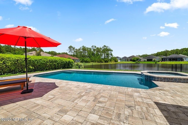 2035 Arden Forest Pl, Fleming Island, FL 32003 - view of pool with a patio area, a fenced backyard, a water view, and a pool with connected hot tub