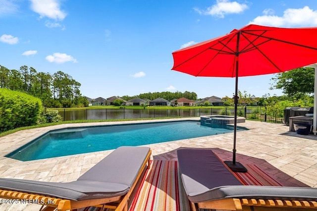 2035 Arden Forest Pl, Fleming Island, FL 32003 - view of pool featuring a patio, a fenced backyard, a pool with connected hot tub, and a water view