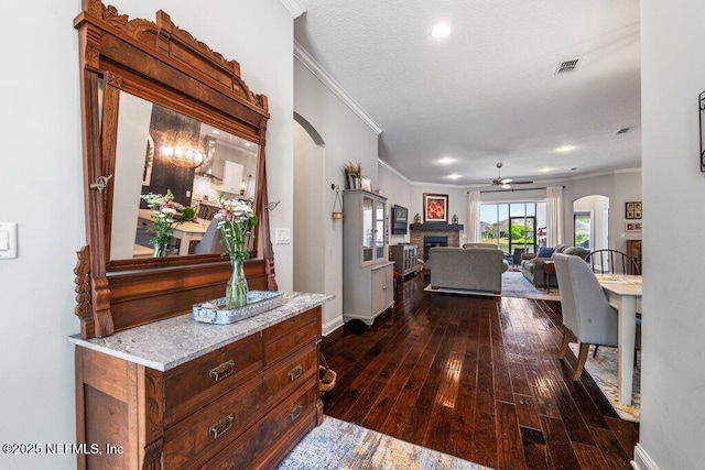 2035 Arden Forest Pl, Fleming Island, FL 32003 - hall featuring ornamental molding, arched walkways, dark wood-style flooring, baseboards, and recessed lighting