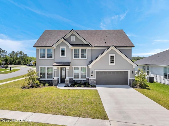 23 Catesby Ln, Saint Augustine, FL 32095 - view of front of house featuring stucco siding, stone siding, a front lawn, and concrete driveway