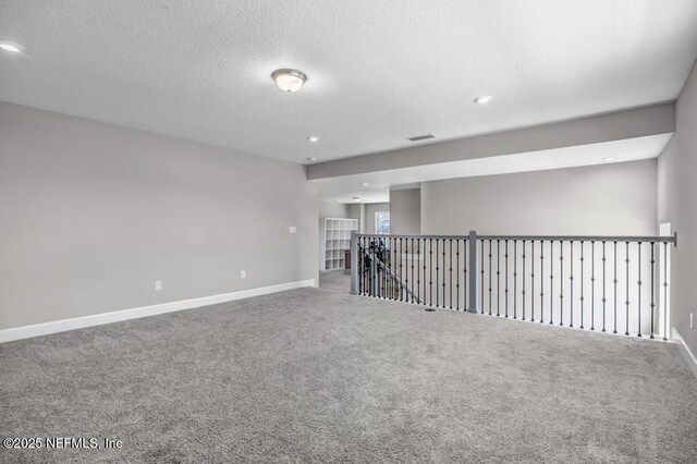23 Catesby Ln, Saint Augustine, FL 32095 - carpeted empty room with recessed lighting, baseboards, and a textured ceiling