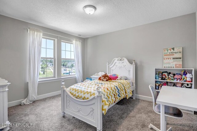 23 Catesby Ln, Saint Augustine, FL 32095 - bedroom featuring a textured ceiling, light carpet, and baseboards