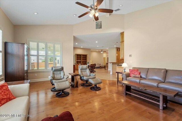 207 Towers Ranch Dr, Saint Augustine, FL 32092 - living room with ceiling fan, light wood-type flooring, high vaulted ceiling, baseboards, and recessed lighting