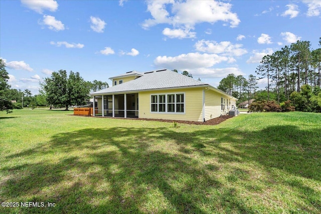 207 Towers Ranch Dr, Saint Augustine, FL 32092 - rear view of property featuring a sunroom and a yard