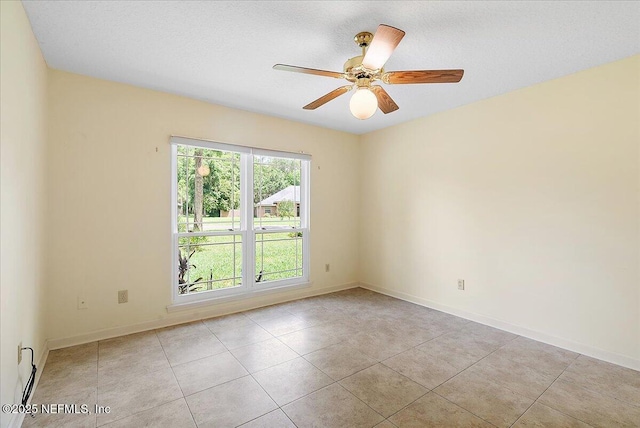 1476 Mallard Landing Blvd, Saint Johns, FL 32259 - spare room featuring a baseboard heating unit, baseboards, tile patterned flooring, and a ceiling fan