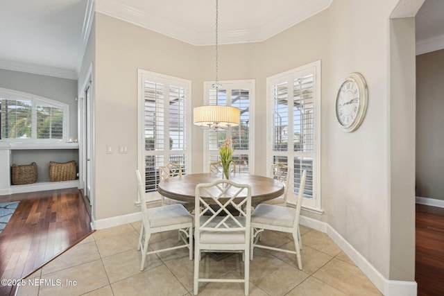 1867 Paradise Moorings Blvd, Middleburg, FL 32068 - dining space with ornamental molding, baseboards, light tile patterned floors, and a chandelier