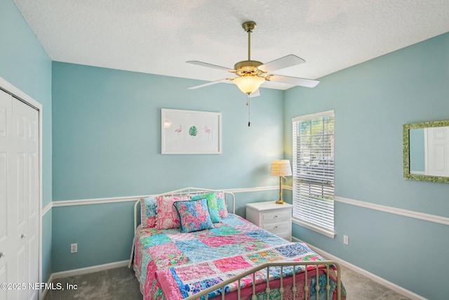 1867 Paradise Moorings Blvd, Middleburg, FL 32068 - bedroom with carpet, a closet, baseboards, ceiling fan, and a textured ceiling