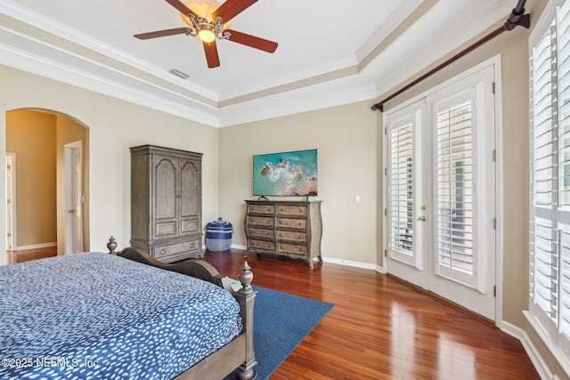 1867 Paradise Moorings Blvd, Middleburg, FL 32068 - bedroom with arched walkways, access to outside, wood finished floors, ornamental molding, and a raised ceiling