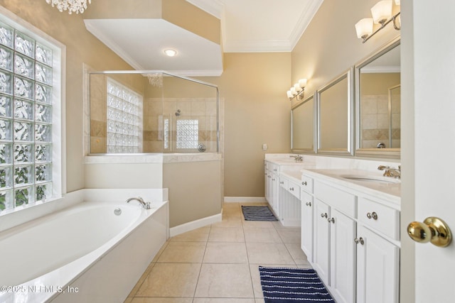 1867 Paradise Moorings Blvd, Middleburg, FL 32068 - bathroom featuring double vanity, a garden tub, a tile shower, ornamental molding, and baseboards