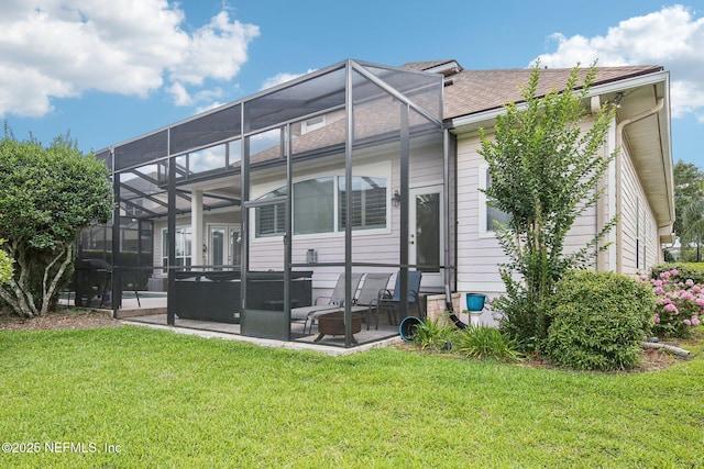 1867 Paradise Moorings Blvd, Middleburg, FL 32068 - rear view of property featuring a patio area, a lawn, glass enclosure, and roof with shingles