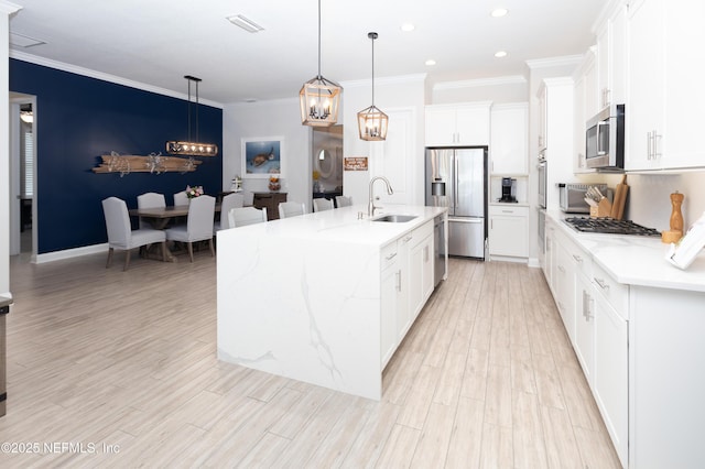 103 Tarbert Ln, Saint Augustine, FL 32092 - kitchen featuring appliances with stainless steel finishes, a sink, ornamental molding, recessed lighting, and a chandelier