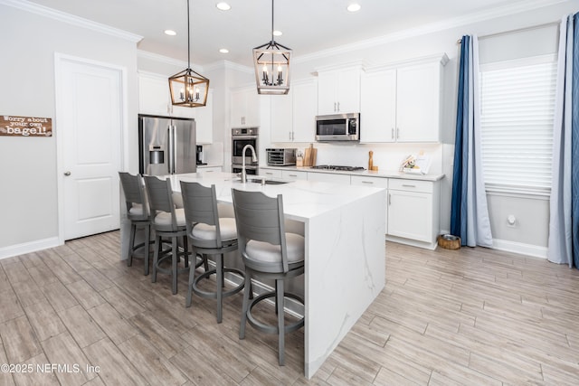 103 Tarbert Ln, Saint Augustine, FL 32092 - kitchen featuring appliances with stainless steel finishes, a chandelier, baseboards, a sink, and recessed lighting