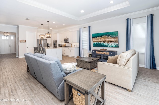 103 Tarbert Ln, Saint Augustine, FL 32092 - living area featuring a chandelier, light wood-style flooring, baseboards, crown molding, and recessed lighting