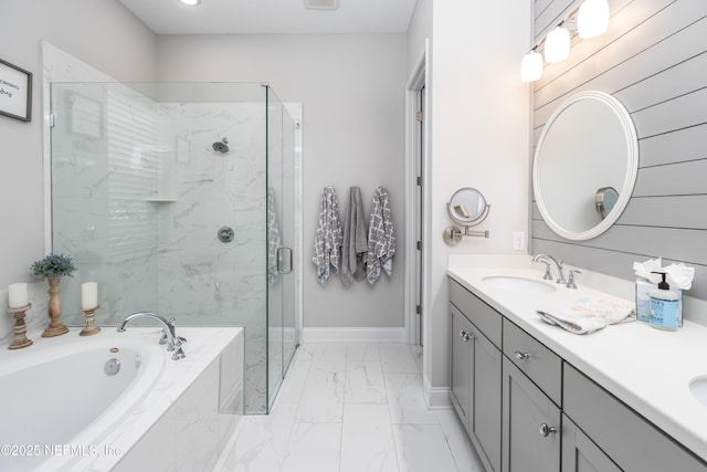 103 Tarbert Ln, Saint Augustine, FL 32092 - bathroom with marble look tile flooring, a shower stall, a garden tub, double vanity, and baseboards