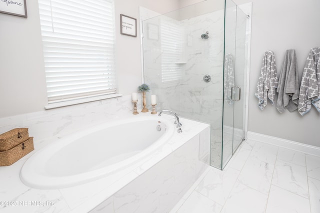 103 Tarbert Ln, Saint Augustine, FL 32092 - full bath featuring marble look tile flooring, a garden tub, a marble finish shower, and baseboards