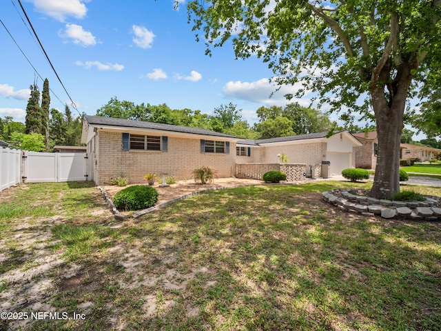 10811 High Ridge Rd, Jacksonville, FL 32225 - view of front facade featuring brick siding, a gate, and an attached garage